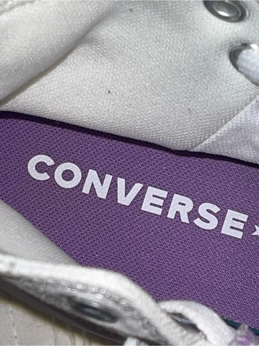 Converse High Top Sneakers in White with Purple Star Accent